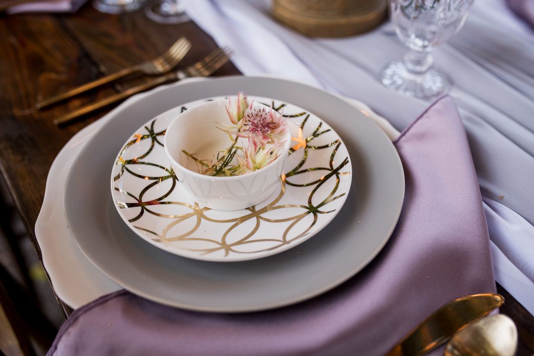 pastel tablescape with earthen china and Darcy charger