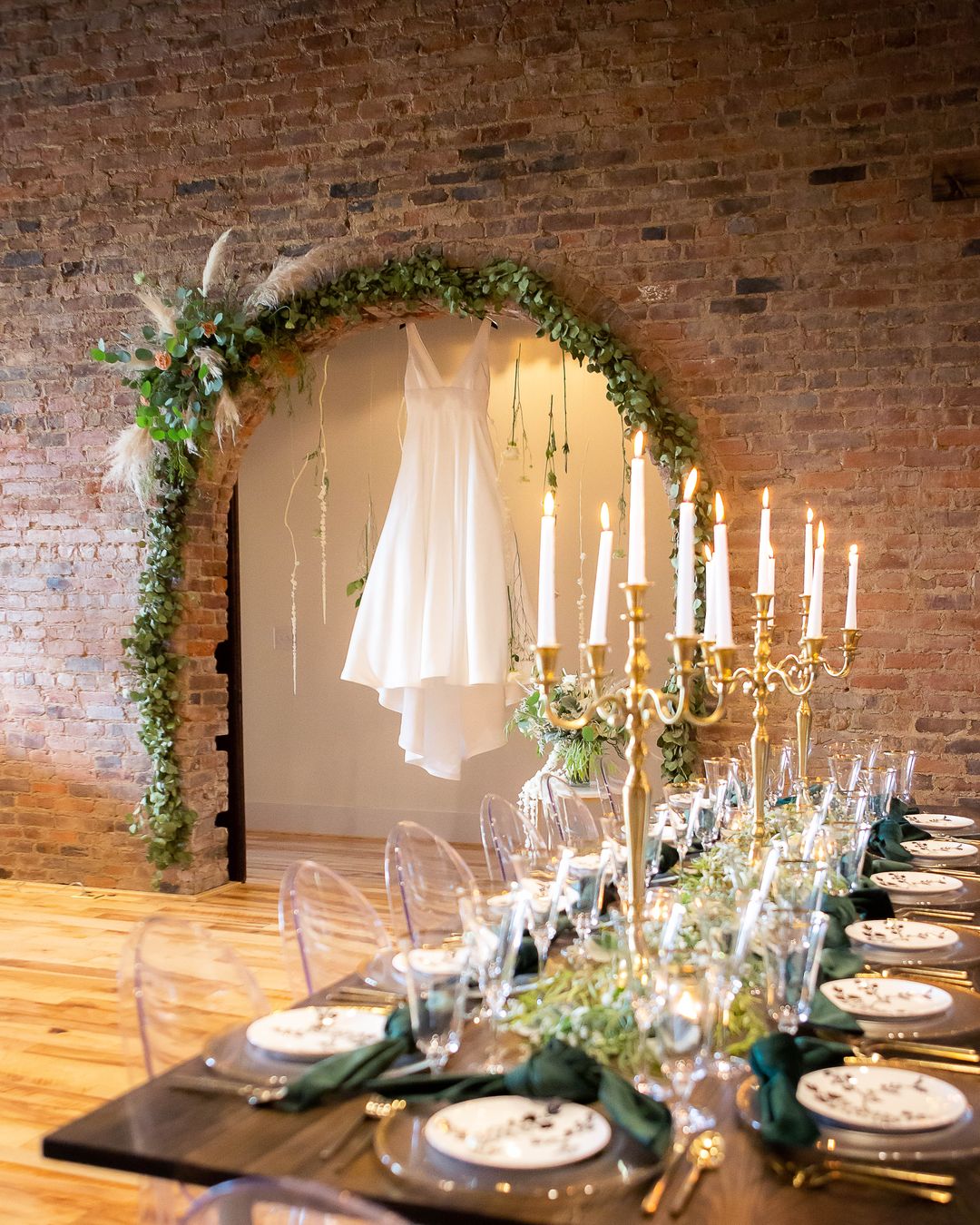 floral arch and white wedding dress