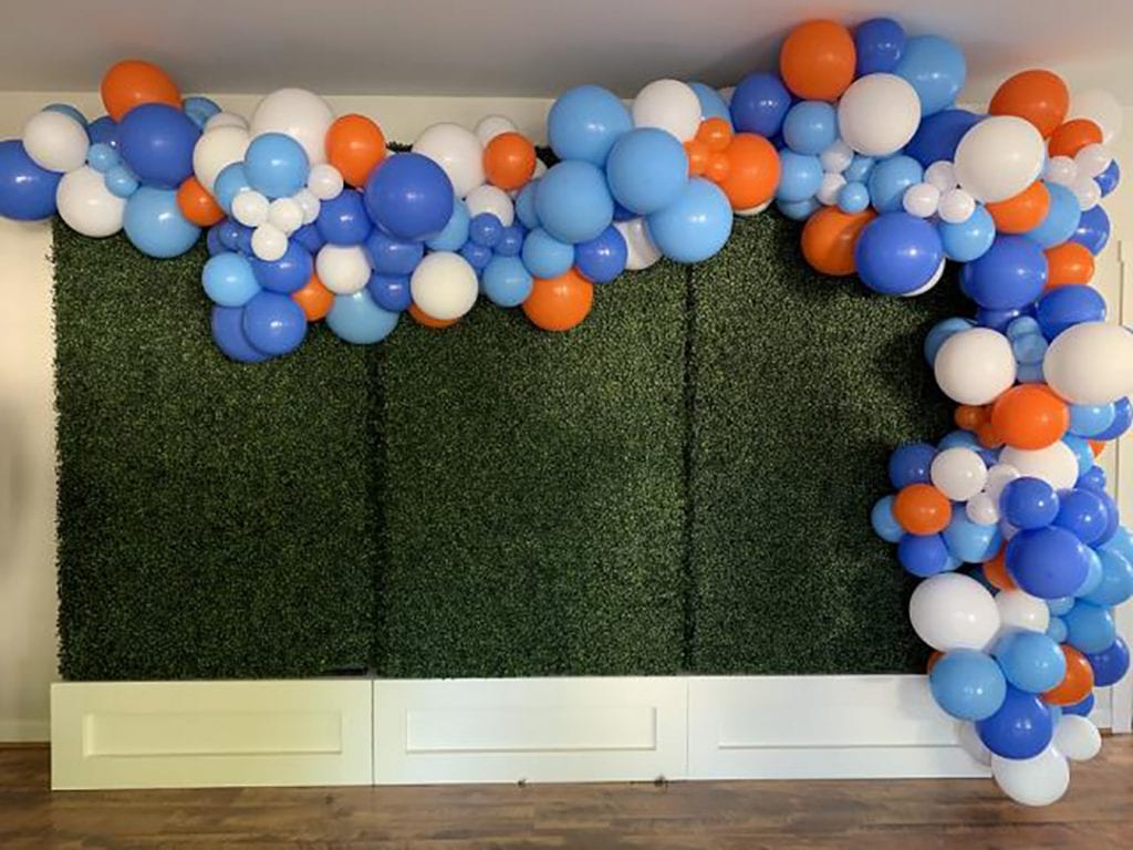 birthday backdrop boxwood wall with balloons