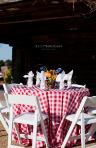A Country setting featuring our Red and White Check Tablecloth and White Wooden Folding Chairs