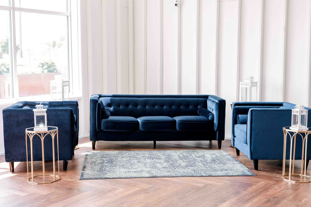 area rug and blue velvet furniture