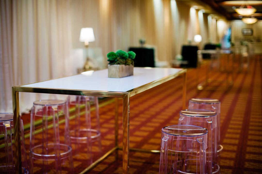 acrylic chairs with gold bistro table