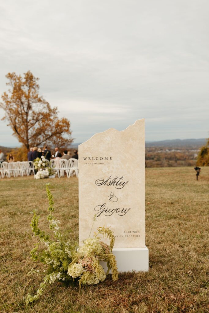 stone wedding welcome sign for outdoor ceremony