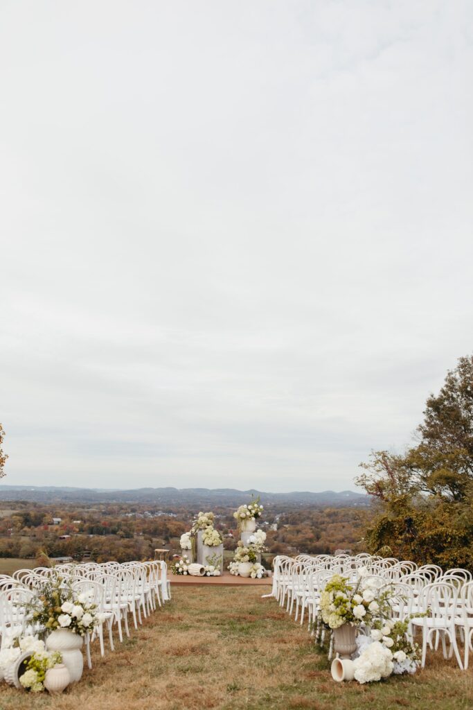 white wedding chairs for outdoor ceremony