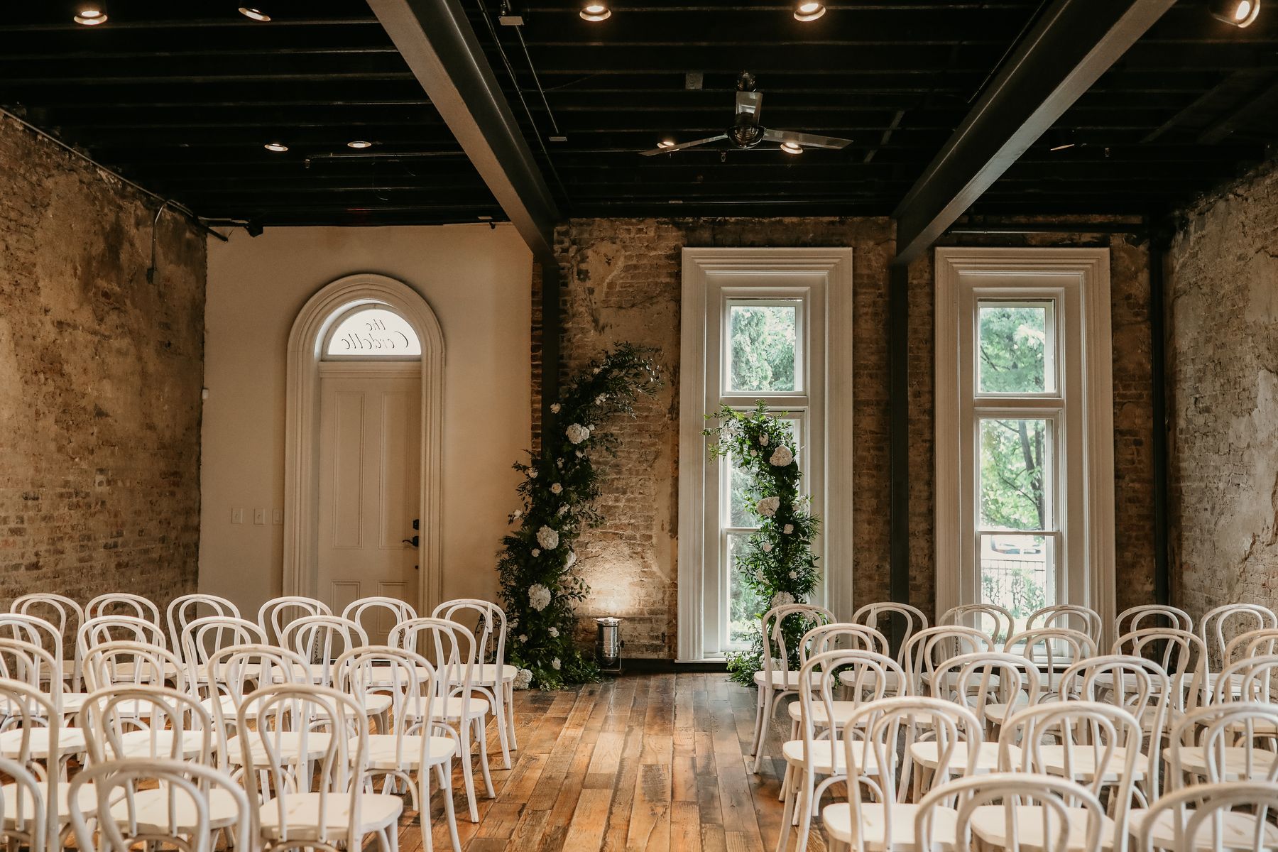 white wedding chairs for indoor ceremony