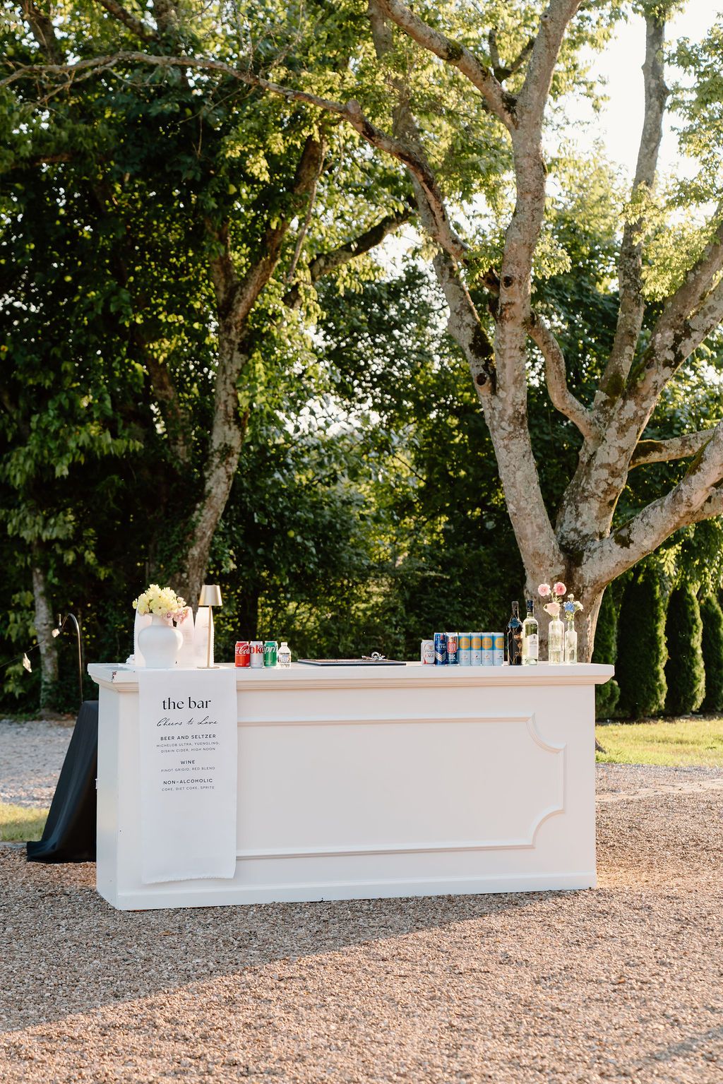 outdoor cocktail hour rentals; white wood event bar