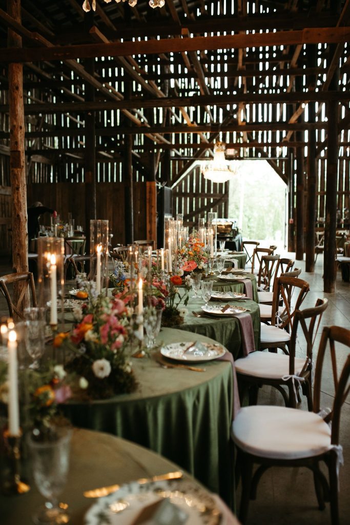 moody modern barn wedding with green velvet tablecloths
