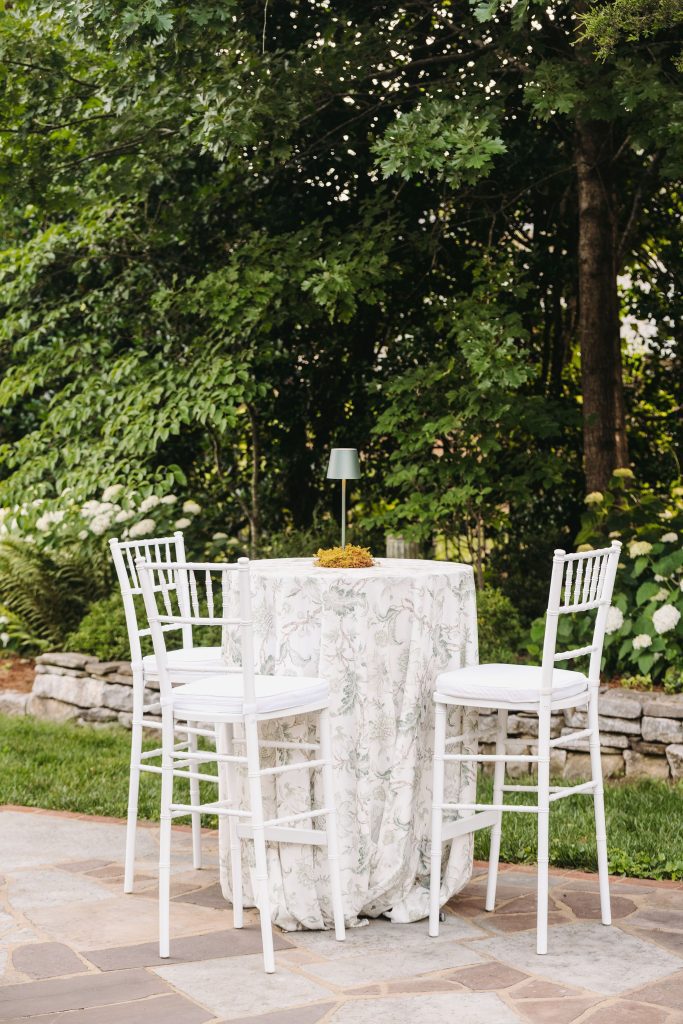 green and white garden cocktail tables with white chiavari barstools