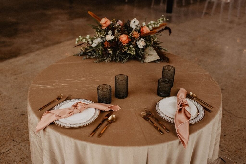 blush and ivory neutral sweetheart table place setting